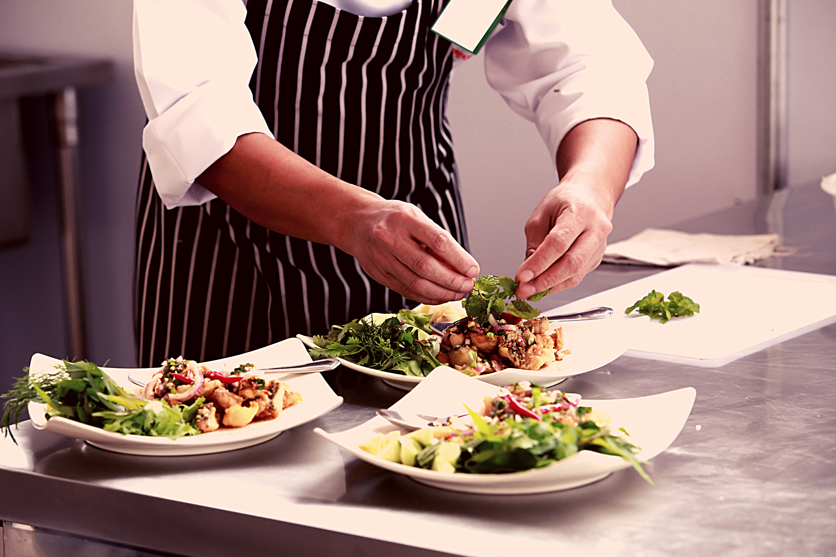 Chef in restaurant kitchen cooking